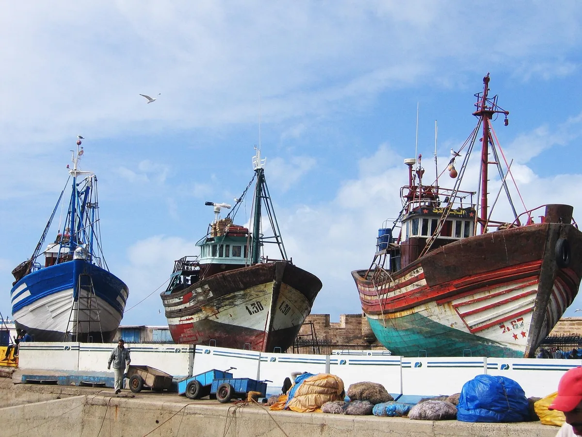 Fishing boats in Essaouira harbour. Coastal towns like Essaouira, and smaller cities such as Chefchaouen, are consistently reported as far lower-hassle than the Marrakech and Fes medinas