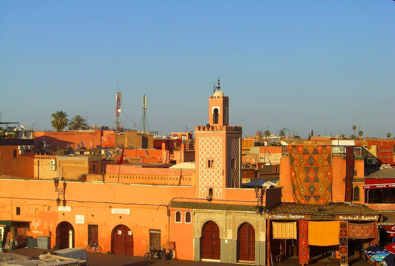 Evening view of a Marrakech medina street with minaret