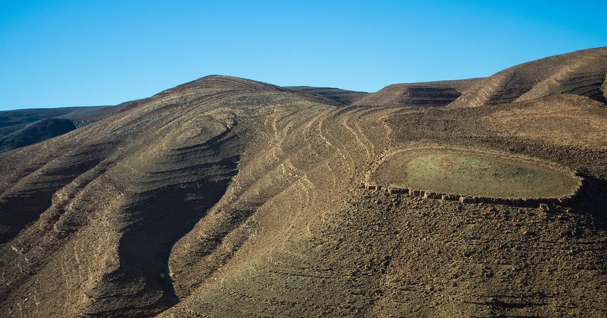 The High Atlas foothills falling away toward the Sahara, the terrain that makes Morocco travel distances longer than they look