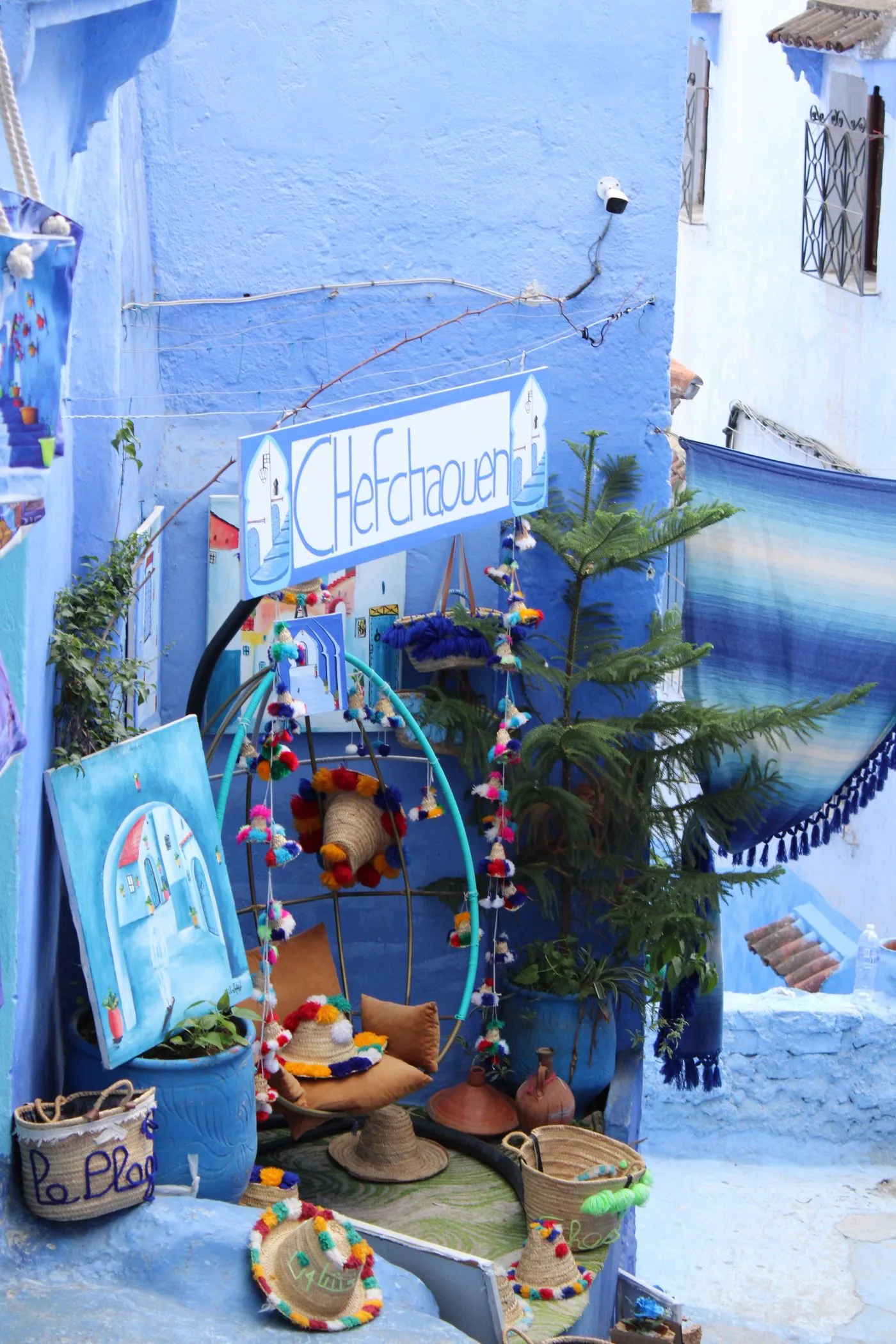 A Morocco travel scene: a street of craft workshops and stalls selling handmade goods